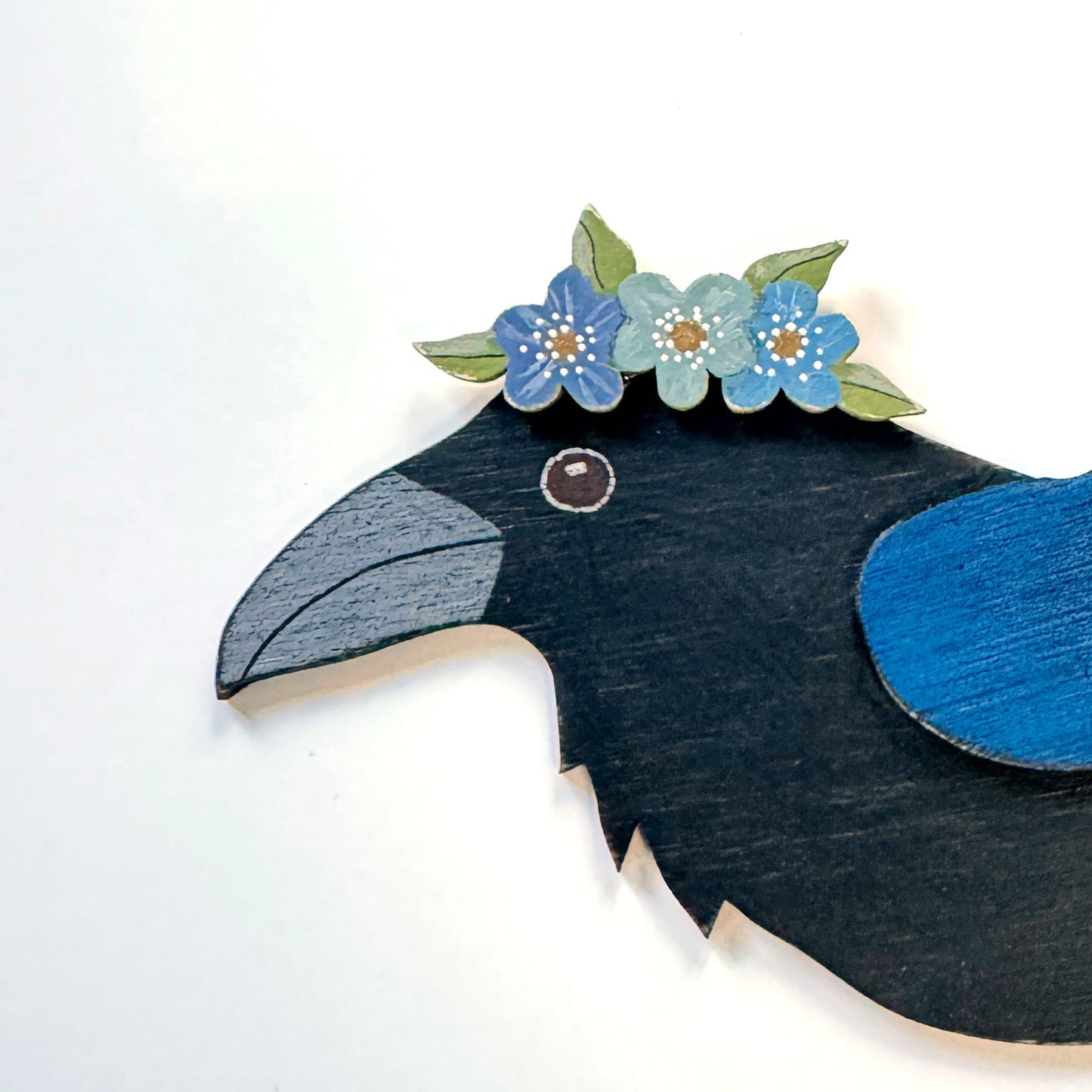 RAVEN WITH BLUE FLORAL CROWN — Hand-Painted Wooden Raven Hanging