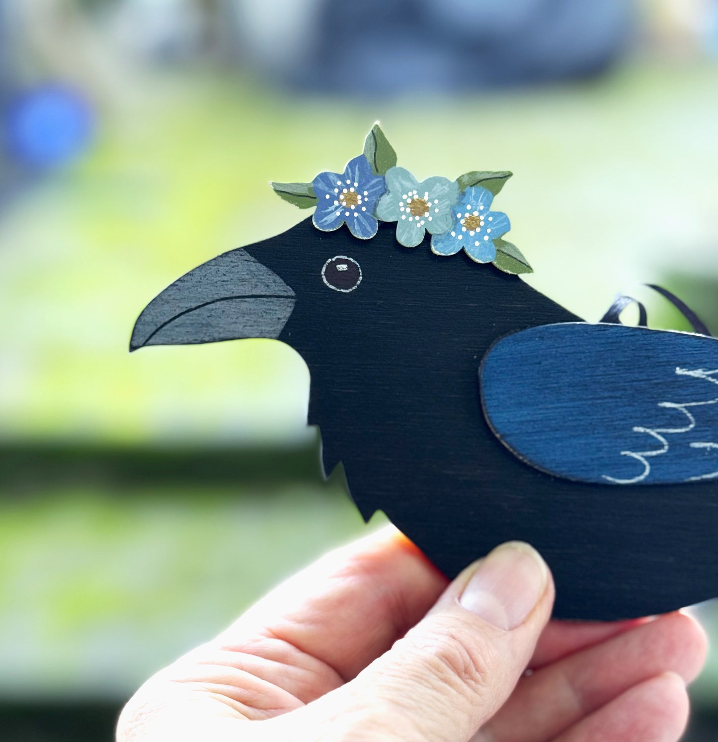 RAVEN WITH BLUE FLORAL CROWN — Hand-Painted Wooden Raven Hanging