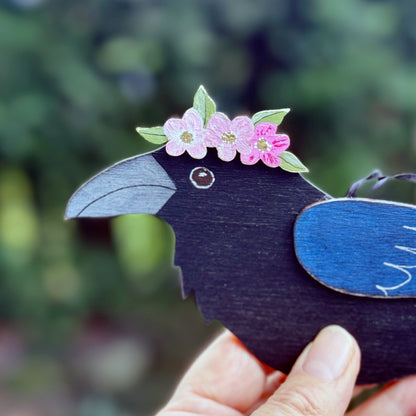 RAVEN WITH PINK FLORAL CROWN — Hand-Painted Wooden Raven Hanging